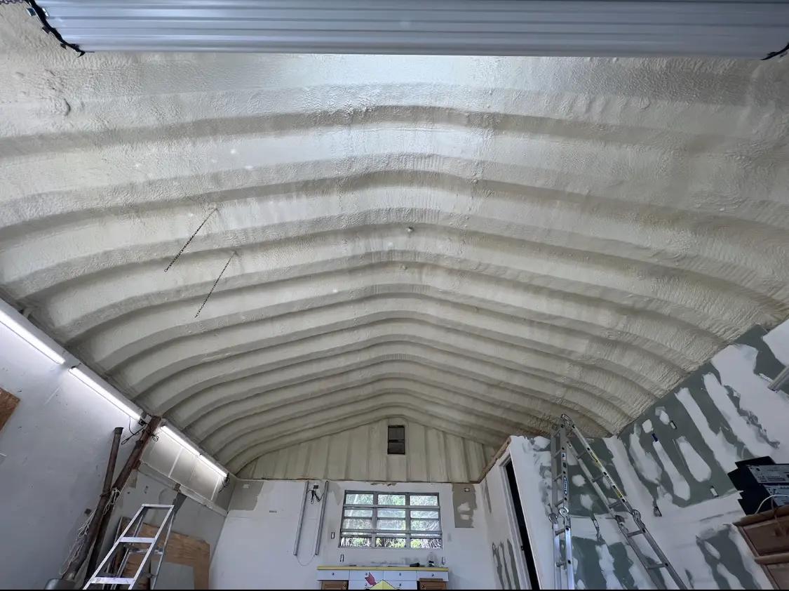 Spray polyurethane foam applied to the underside of a metal roof deck in Bath